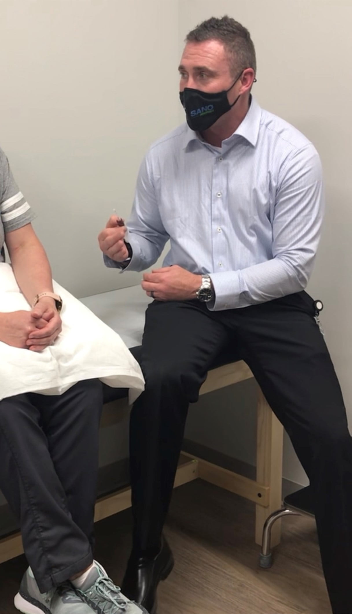 dr. kevin witte talks to a patient about PRP
